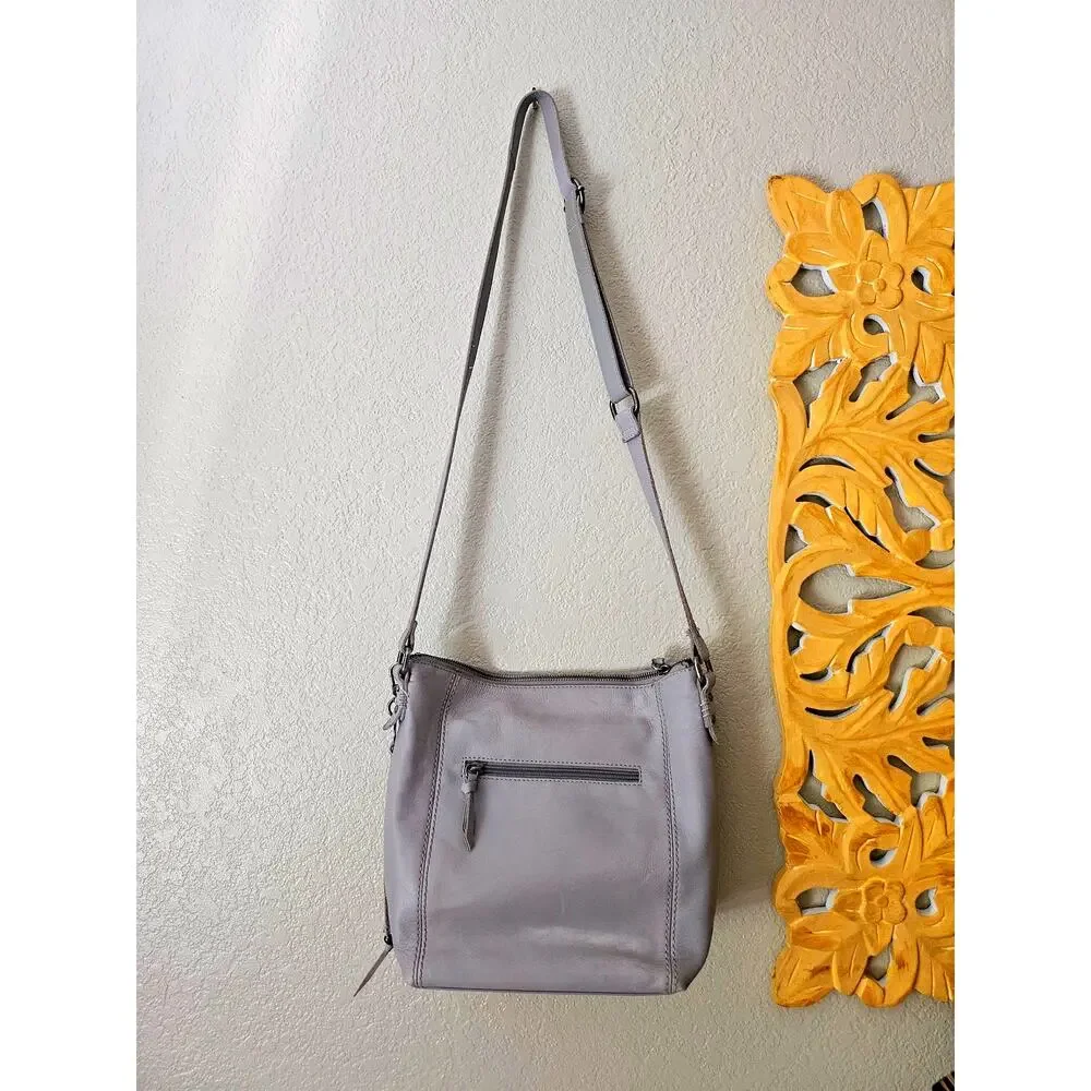 The Sak Stone Gray Leather Crossbody, adjustable, tassel detail